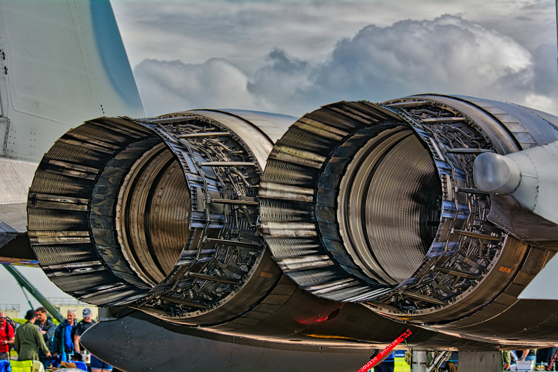 white and gold-colored airplane close-up photography